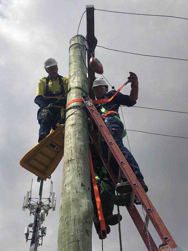 Tom Metzner working at electric pole